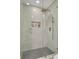This bathroom features a luxurious glass-enclosed shower with a herringbone tile floor at 12092 97Th Ave, Seminole, FL 33772