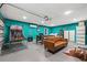 Finished basement with a pool table, basketball hoop game, laundry machines and a brown sofa at 1242 Whisper Dr, Largo, FL 33770