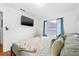 Bright bedroom featuring a window, and modern decor at 1242 Whisper Dr, Largo, FL 33770