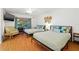 Spacious bedroom featuring two beds, a ceiling fan, and access to an outdoor area at 1242 Whisper Dr, Largo, FL 33770