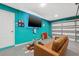 Finished garage with a couch and wall mounted tv at 1242 Whisper Dr, Largo, FL 33770