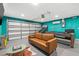 Finished garage featuring a pool table, basketball hoop and a couch at 1242 Whisper Dr, Largo, FL 33770