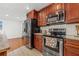 Featuring stainless steel appliances, including range and refrigerator in this kitchen at 1242 Whisper Dr, Largo, FL 33770