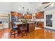 Kitchen featuring stainless steel appliances, granite countertops, an island with seating, and wood cabinetry at 1242 Whisper Dr, Largo, FL 33770