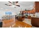 Spacious open layout showing the kitchen with granite island and the dining area with seating for ten at 1242 Whisper Dr, Largo, FL 33770