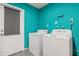 Laundry room featuring a washer and dryer along with a white door leading to the exterior at 1242 Whisper Dr, Largo, FL 33770