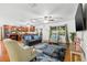 Bright, spacious living area features a view of the kitchen, stylish furnishings, and a large window at 1242 Whisper Dr, Largo, FL 33770