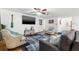 Inviting living room with a large flat-screen TV, comfortable seating, and stylish decor for relaxed gatherings at 1242 Whisper Dr, Largo, FL 33770