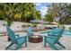 Outdoor pool area with seating, fire pit, and lounge chairs, designed for ultimate relaxation at 1242 Whisper Dr, Largo, FL 33770
