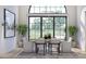 Inviting dining room with large windows offering scenic views and a stylish lighting fixture at 125 Avonwood, Tampa, FL 33625