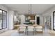Bright dining room featuring an ornate chandelier and wooden table with chairs at 125 Avonwood, Tampa, FL 33625