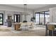 Bright and airy dining room featuring a large table, modern chairs, and natural light at 125 Avonwood, Tampa, FL 33625