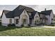 Stunning home showcases stone and siding accents and a well-maintained lawn at 125 Avonwood, Tampa, FL 33625