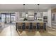 Bright and open kitchen features a spacious island with seating and modern lighting fixtures at 125 Avonwood, Tampa, FL 33625