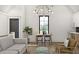 Open concept living room with bright lighting, vaulted ceilings, and a kitchen area at 125 Avonwood, Tampa, FL 33625