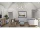 Cozy living room with modern lighting, comfortable seating, and a vaulted ceiling at 125 Avonwood, Tampa, FL 33625