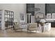 Elegant living room includes a fireplace, hardwood floors, and comfortable seating area at 125 Avonwood, Tampa, FL 33625