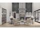 Modern living room features a stunning fireplace, chic lighting, and stylish furniture at 125 Avonwood, Tampa, FL 33625