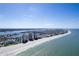 Breathtaking aerial shot captures the stunning coastline with the sandy beach and buildings along the waterfront at 13883 Jamaica Dr, Seminole, FL 33776