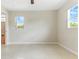 Well lit bedroom with view to en suite at 13883 Jamaica Dr, Seminole, FL 33776