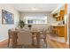 Bright dining room featuring hardwood floors, a dining table, and a view of backyard at 13883 Jamaica Dr, Seminole, FL 33776