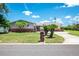 Charming single-story home with well-manicured lawn, palm trees, and a brick mailbox at 13883 Jamaica Dr, Seminole, FL 33776