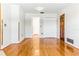 Bright room with hardwood floors and doorways leading to other rooms at 13883 Jamaica Dr, Seminole, FL 33776