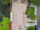 Aerial view of a townhouse complex backing onto a serene lake, showcasing peaceful surroundings at 1508 Adams E Cir, Largo, FL 33771