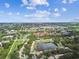 Aerial view of the townhouse backing up to a beautiful pond at 1508 Adams E Cir, Largo, FL 33771