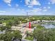 Aerial view of the townhouse and water views, situated in a lush green area at 1508 Adams E Cir, Largo, FL 33771