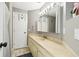 Neutral bathroom with a large mirror, ample countertop space, and great storage at 1508 Adams E Cir, Largo, FL 33771