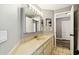 Bright bathroom featuring a sleek sink, modern fixtures, and a mirrored cabinet with storage at 1508 Adams E Cir, Largo, FL 33771