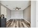 A neutral colored bedroom with wood-look floors and a ceiling fan at 1508 Adams E Cir, Largo, FL 33771