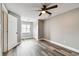 Sunlit bedroom featuring modern flooring, closet space, and a ceiling fan at 1508 Adams E Cir, Largo, FL 33771