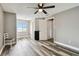 A neutral colored bedroom with wood-look floors, a ceiling fan and lots of natural light at 1508 Adams E Cir, Largo, FL 33771