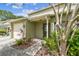 Welcoming townhouse entryway surrounded by lush plantings, offering a charming curb appeal at 1508 Adams E Cir, Largo, FL 33771