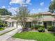 Desirable end-unit townhouse with an attached garage and well-kept landscaping at 1508 Adams E Cir, Largo, FL 33771