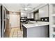 Modern kitchen featuring stainless appliances, quartz counters, and white cabinets at 1508 Adams E Cir, Largo, FL 33771