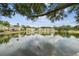 A beautiful view of a lily pad filled pond and a fountain in the distance at 1508 Adams E Cir, Largo, FL 33771