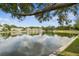 This amazing view shows the pond, trees and other homes that surround the property at 1508 Adams E Cir, Largo, FL 33771