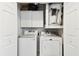 The laundry room features a newer washer and dryer and extra storage space at 1508 Adams E Cir, Largo, FL 33771