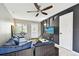 Comfortable living room with large sofa, neutral walls, and outdoor access at 1508 Adams E Cir, Largo, FL 33771