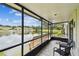 Enjoy the screened in porch overlooking a peaceful lily pad covered lake with a fountain at 1508 Adams E Cir, Largo, FL 33771