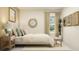 Inviting bedroom featuring neutral colors, comfortable bed, wooden accents, and ample natural light at 1554 Serenity Outlook Ct, Lutz, FL 33548
