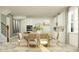 Spacious dining area with ample seating, modern decor, and seamless transition to the kitchen space at 1554 Serenity Outlook Ct, Lutz, FL 33548