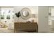 Elegant entryway with console table, decorative mirror, and contemporary decor, perfect for welcoming guests at 1554 Serenity Outlook Ct, Lutz, FL 33548