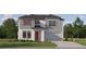 Charming two-story home with neutral siding, a red door, a two-car garage and nicely landscaped yard at 1554 Serenity Outlook Ct, Lutz, FL 33548