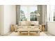 Comfortable living room featuring neutral tones, natural light, and stylish decor for a serene ambiance at 1554 Serenity Outlook Ct, Lutz, FL 33548