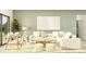Bright living room with large sectional sofa and neutral tones, creating a relaxing atmosphere at 1554 Serenity Outlook Ct, Lutz, FL 33548