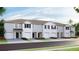 Charming townhomes featuring attached garages and beautifully landscaped front yards at 17465 Spanish Oak Loop, Land O Lakes, FL 34638
